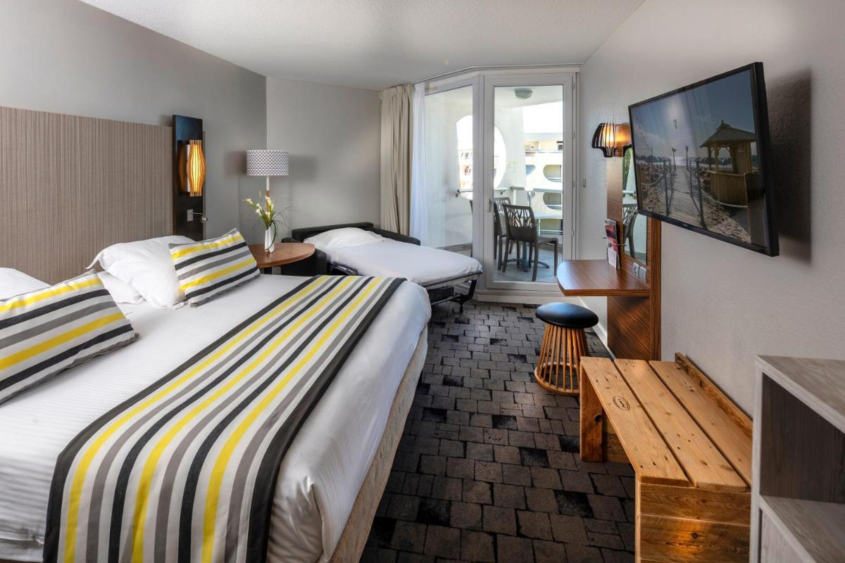 Un ou plusieurs lits dans un hébergement de l'établissement Thalazur Port-Camargue - Hotel & Spa