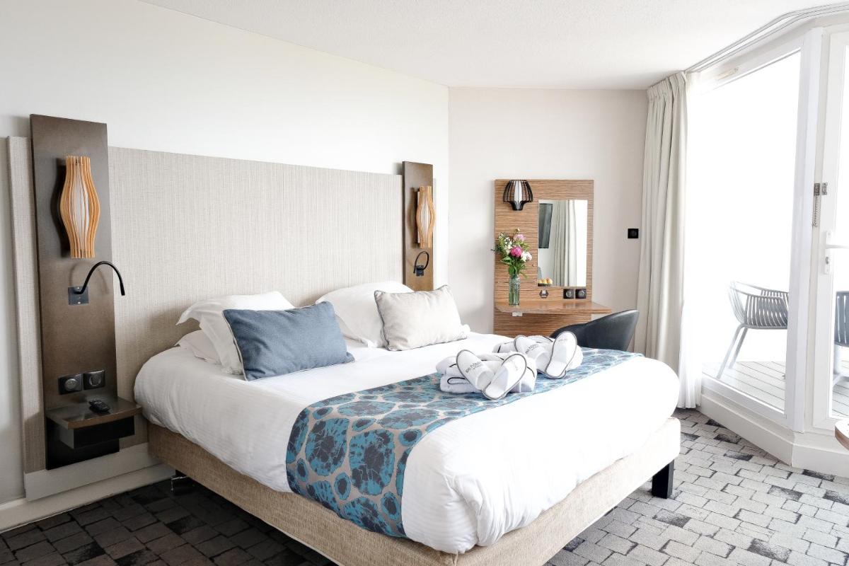 Un ou plusieurs lits dans un hébergement de l'établissement Thalazur Port-Camargue - Hotel & Spa