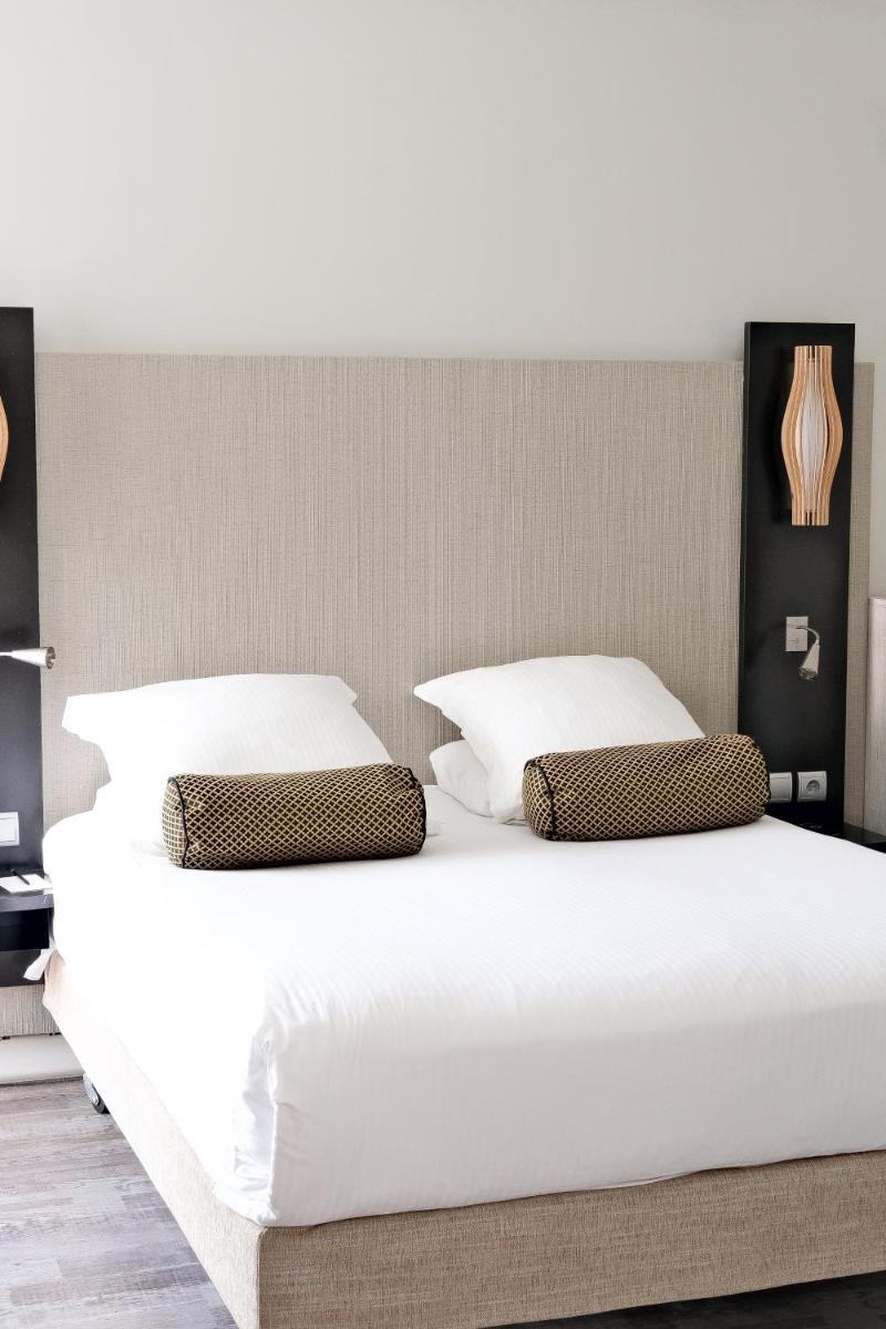 Un ou plusieurs lits dans un hébergement de l'établissement Thalazur Port-Camargue - Hotel & Spa