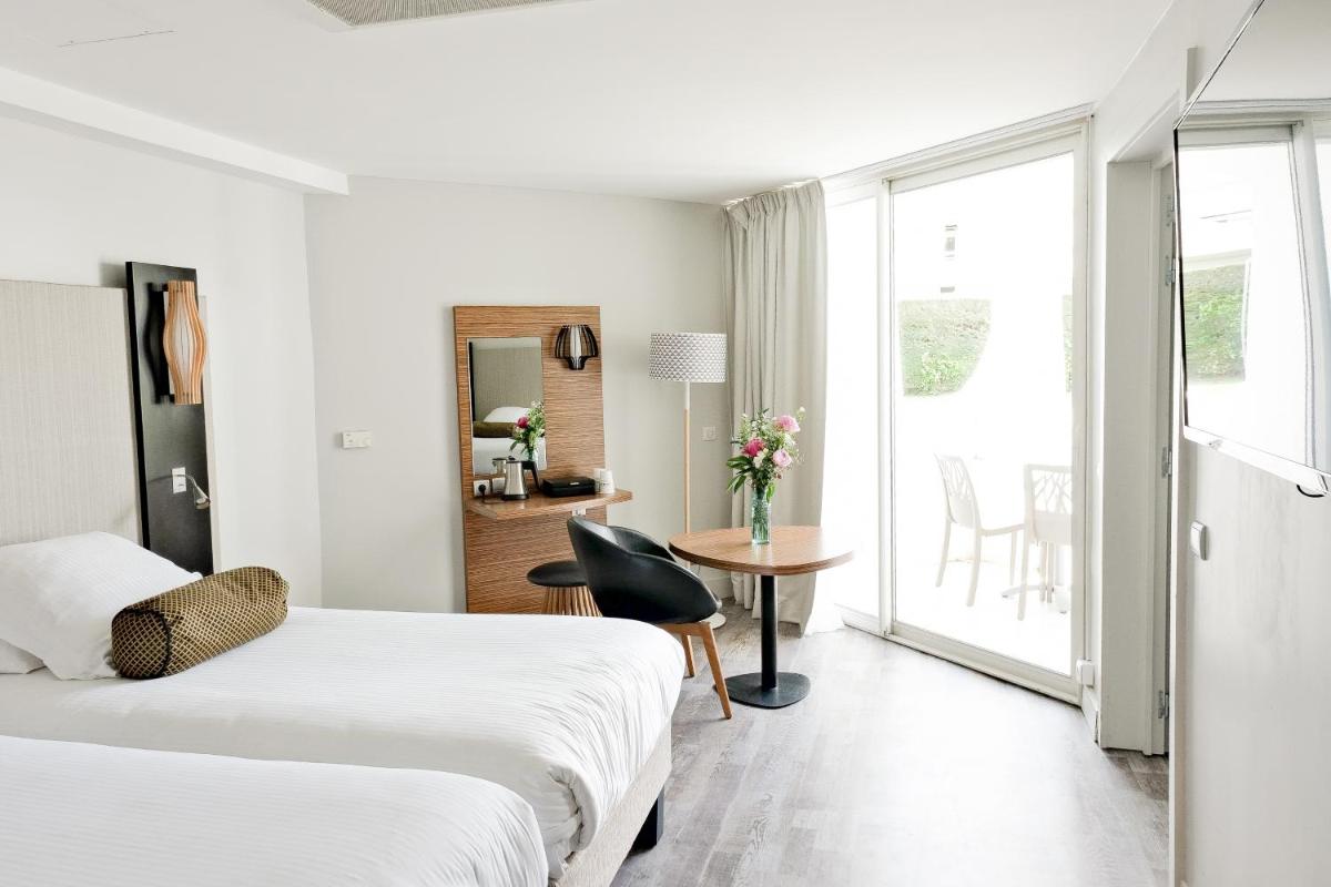 Un ou plusieurs lits dans un hébergement de l'établissement Thalazur Port-Camargue - Hotel & Spa