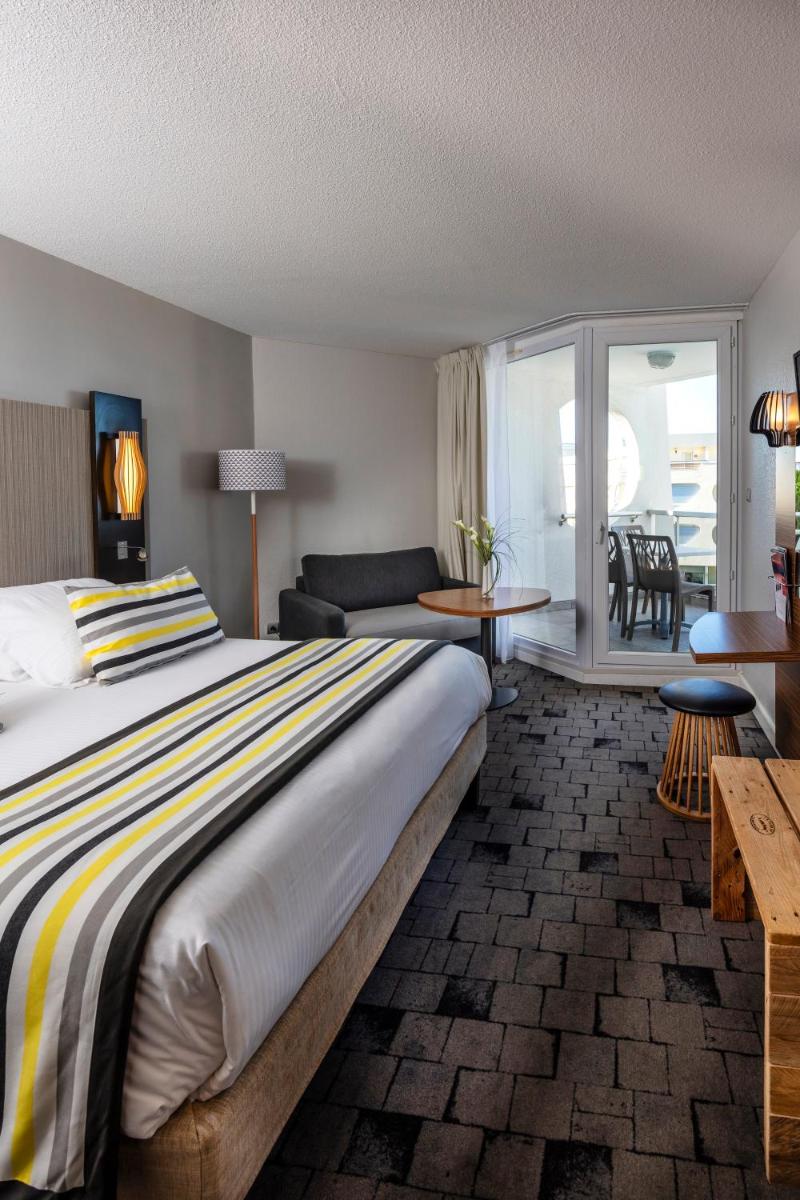 Un ou plusieurs lits dans un hébergement de l'établissement Thalazur Port-Camargue - Hotel & Spa