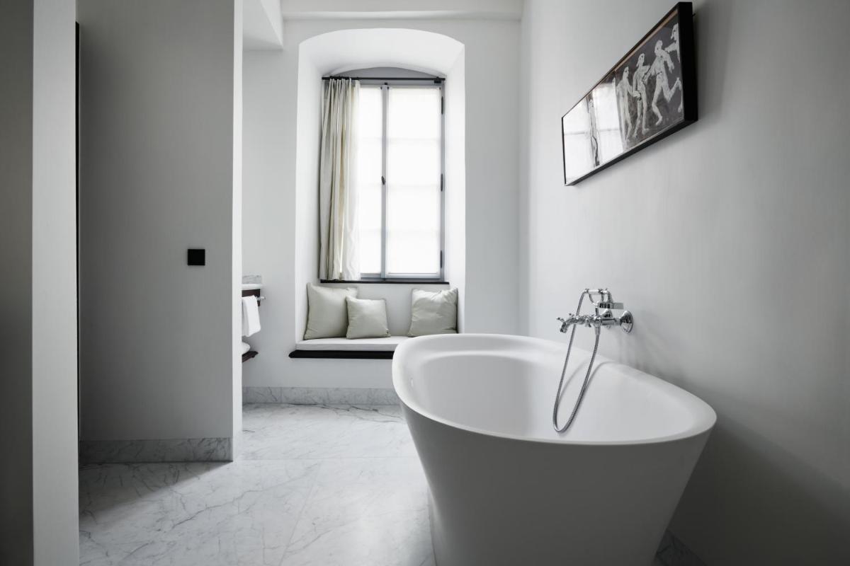 Ein Badezimmer in der Unterkunft Hotel PURS