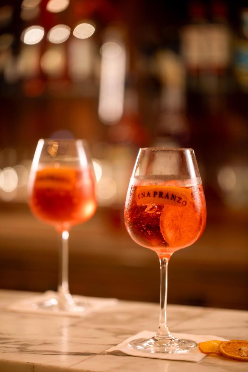 two glasses of wine sitting on a table at Grand Hyatt Gurgaon in Gurgaon