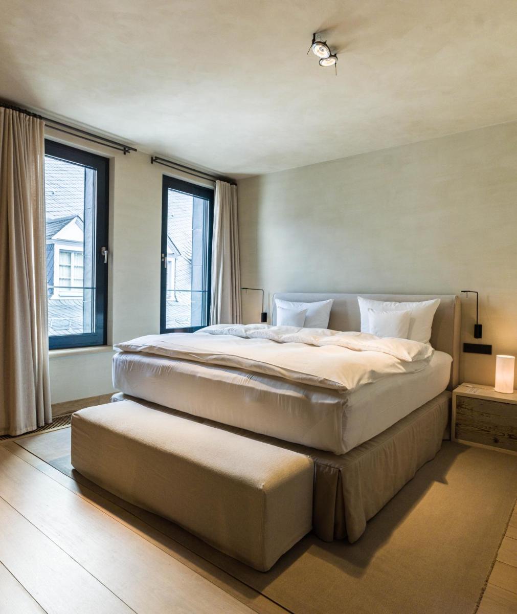 Ein Bett oder Betten in einem Zimmer der Unterkunft Hotel PURS