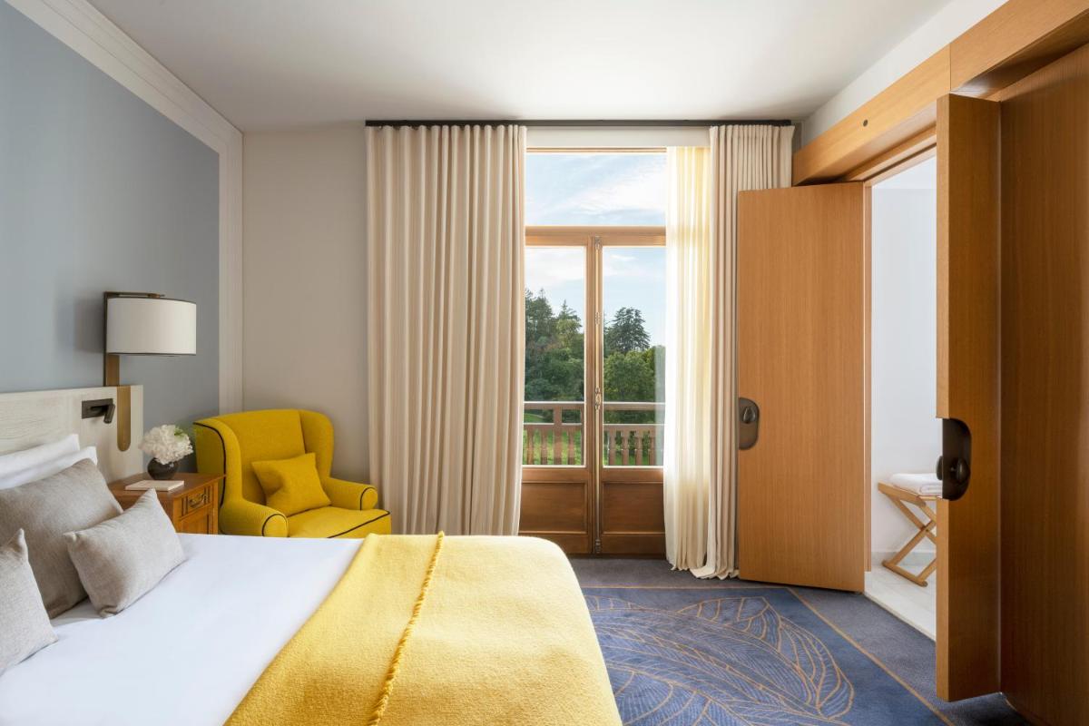 Un ou plusieurs lits dans un hébergement de l'établissement Hôtel Royal