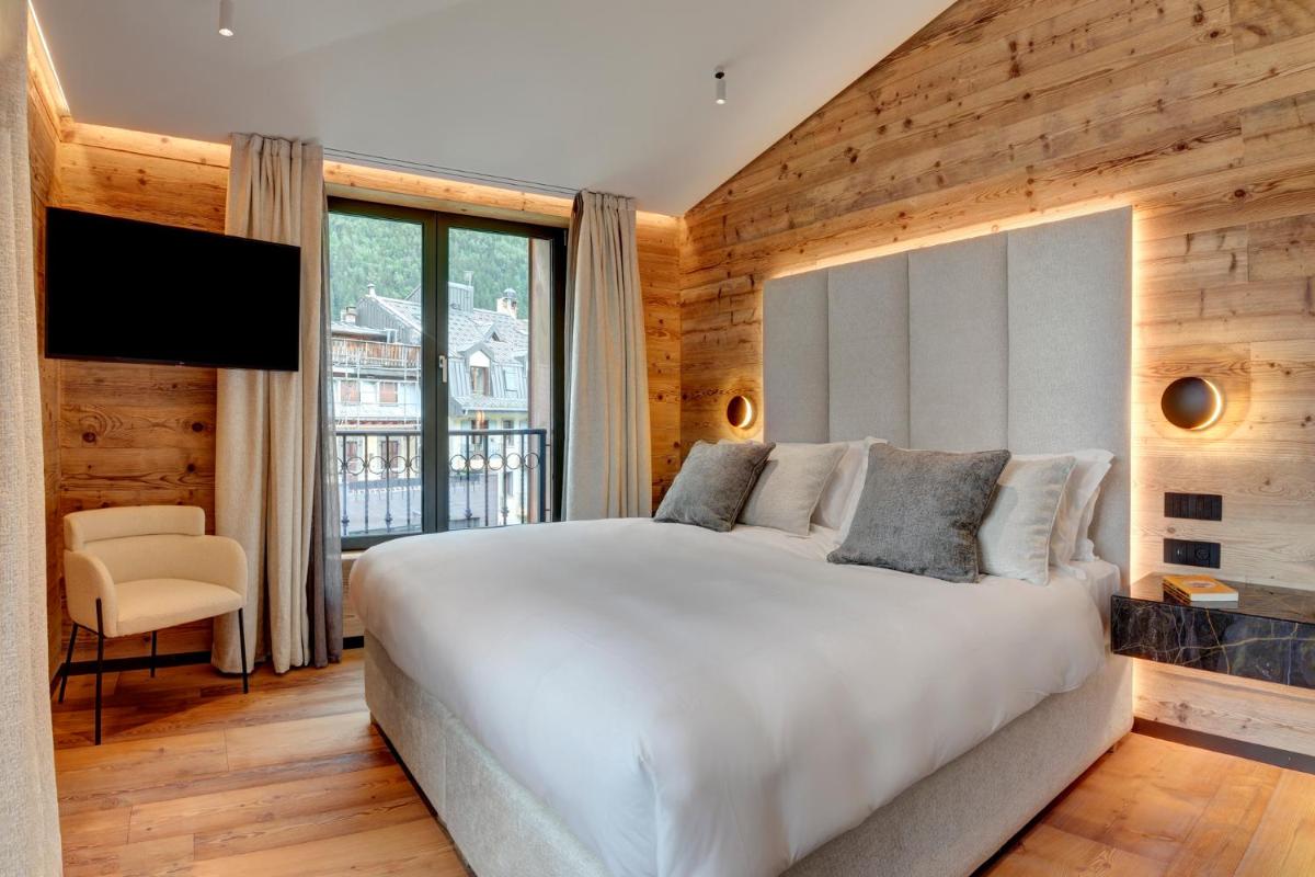 Un ou plusieurs lits dans un hébergement de l'établissement Grand Hôtel des Alpes