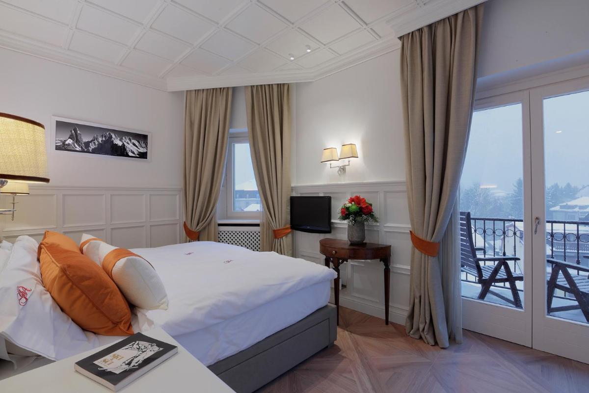 Un ou plusieurs lits dans un hébergement de l'établissement Grand Hôtel des Alpes