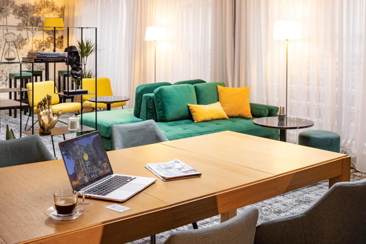 Coin salon dans l'établissement Hotel Residence Europe & Spa