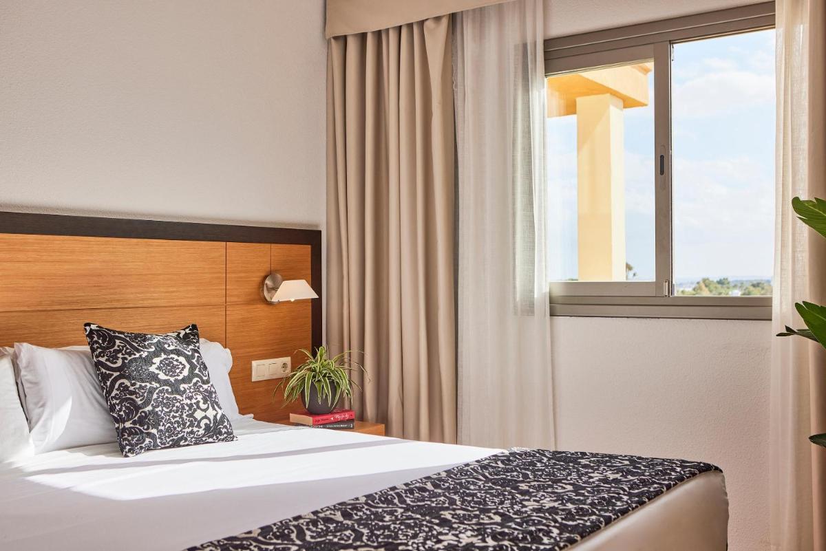 Cama o camas de una habitación en Zafiro Tropic