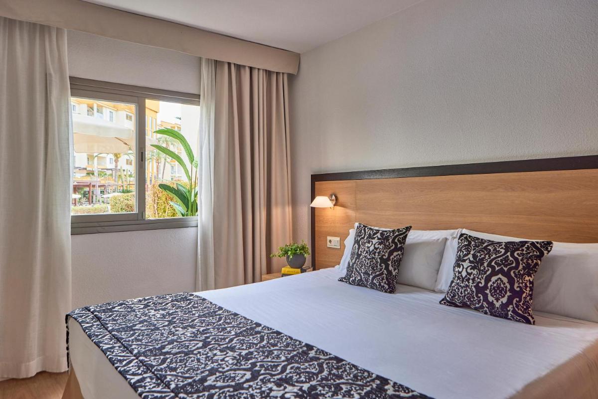 Cama o camas de una habitación en Zafiro Tropic