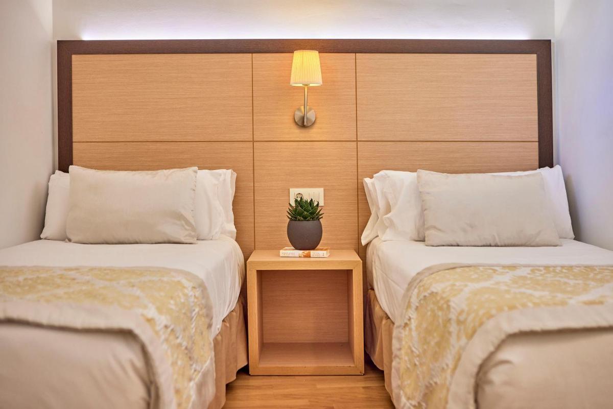 Cama o camas de una habitación en Zafiro Tropic