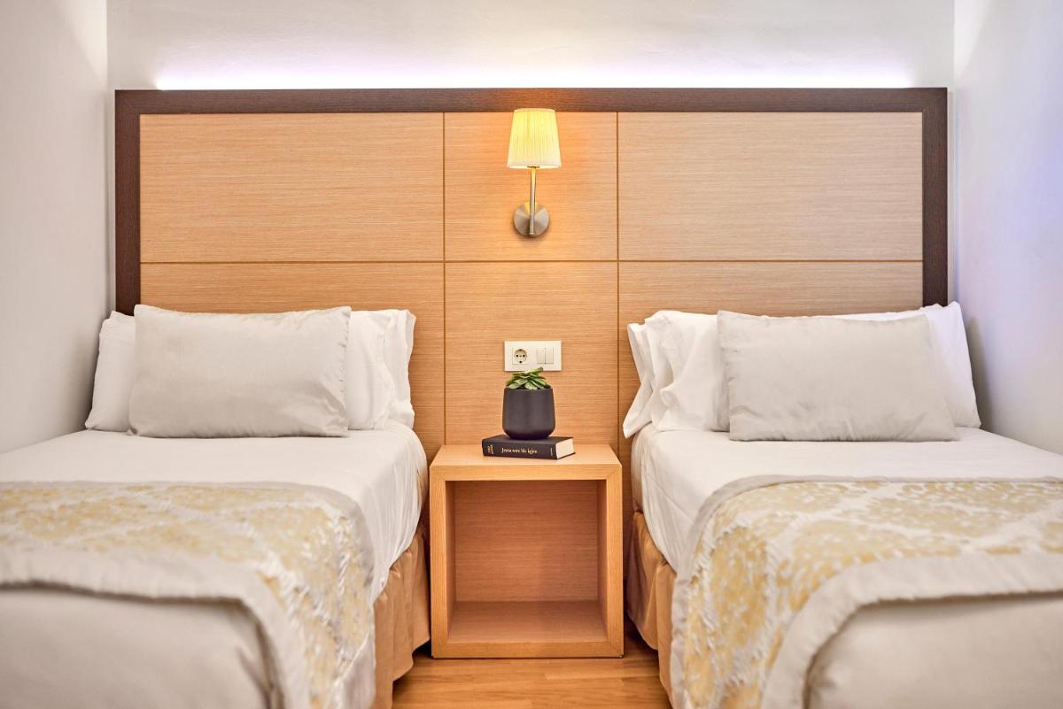 Cama o camas de una habitación en Zafiro Tropic