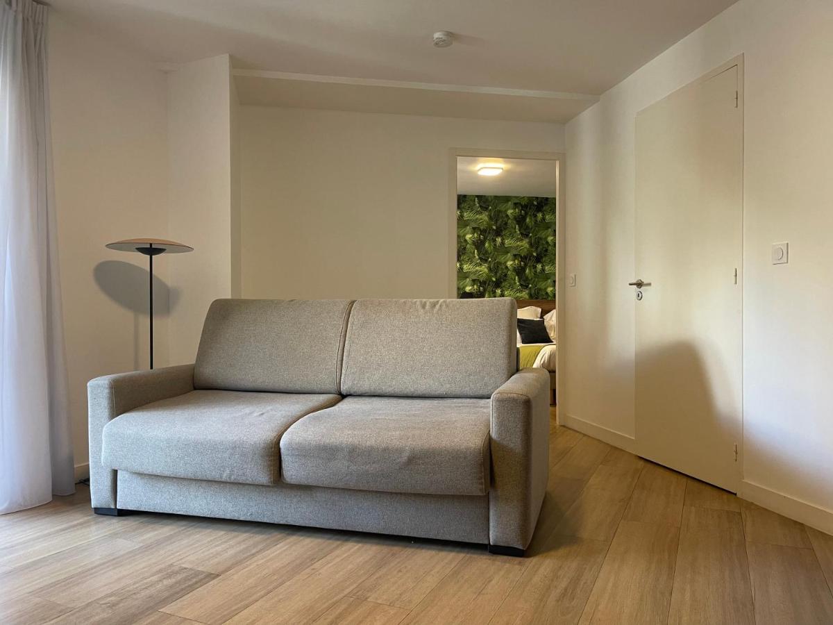 Coin salon dans l'établissement ATHOME RESIDENCE ET SPA
