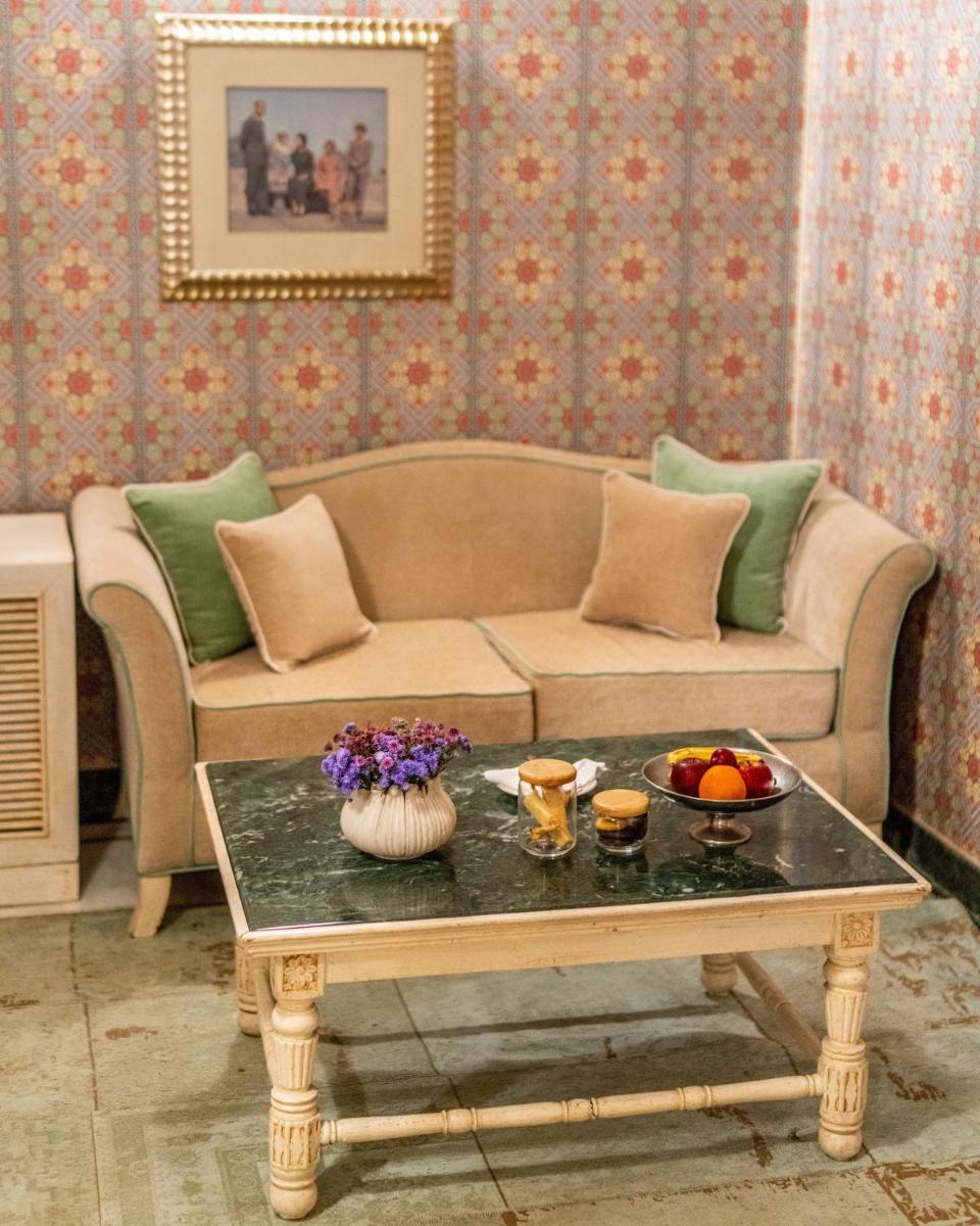 a living room with a couch and a coffee table at Rajmahal Palace RAAS in Jaipur