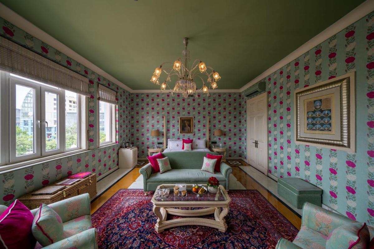 a living room with a couch and a table at Rajmahal Palace RAAS in Jaipur