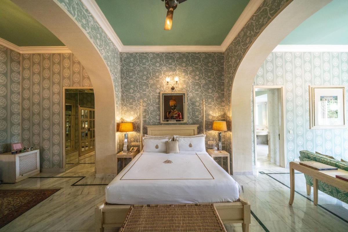 a bedroom with a large bed in a room at Rajmahal Palace RAAS in Jaipur