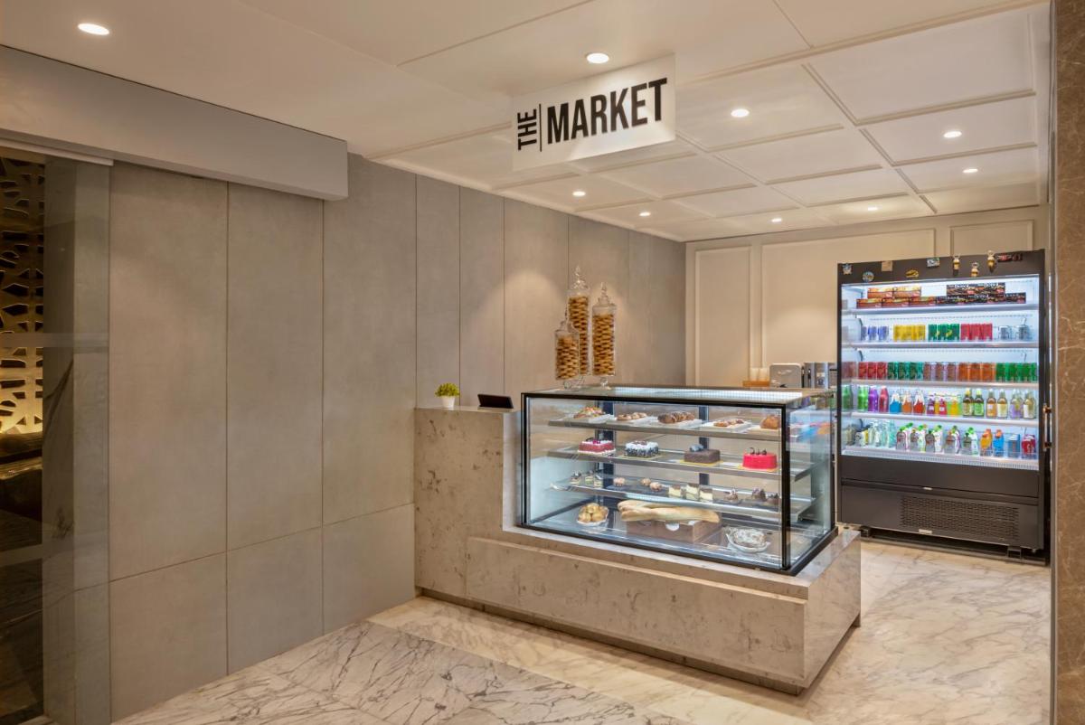a display case in a store with shoes in it at Hyatt Place Goa Candolim in Candolim a display case in a store with shoes in it at Hyatt Place Goa Candolim in Candolim