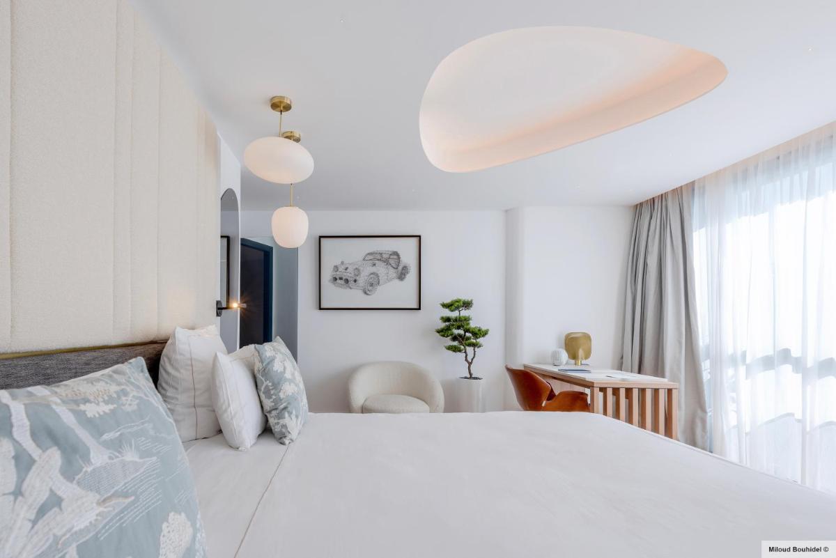 Un ou plusieurs lits dans un hébergement de l'établissement GOLDEN TULIP LYON OUEST TECHLID Hotel & Spa
