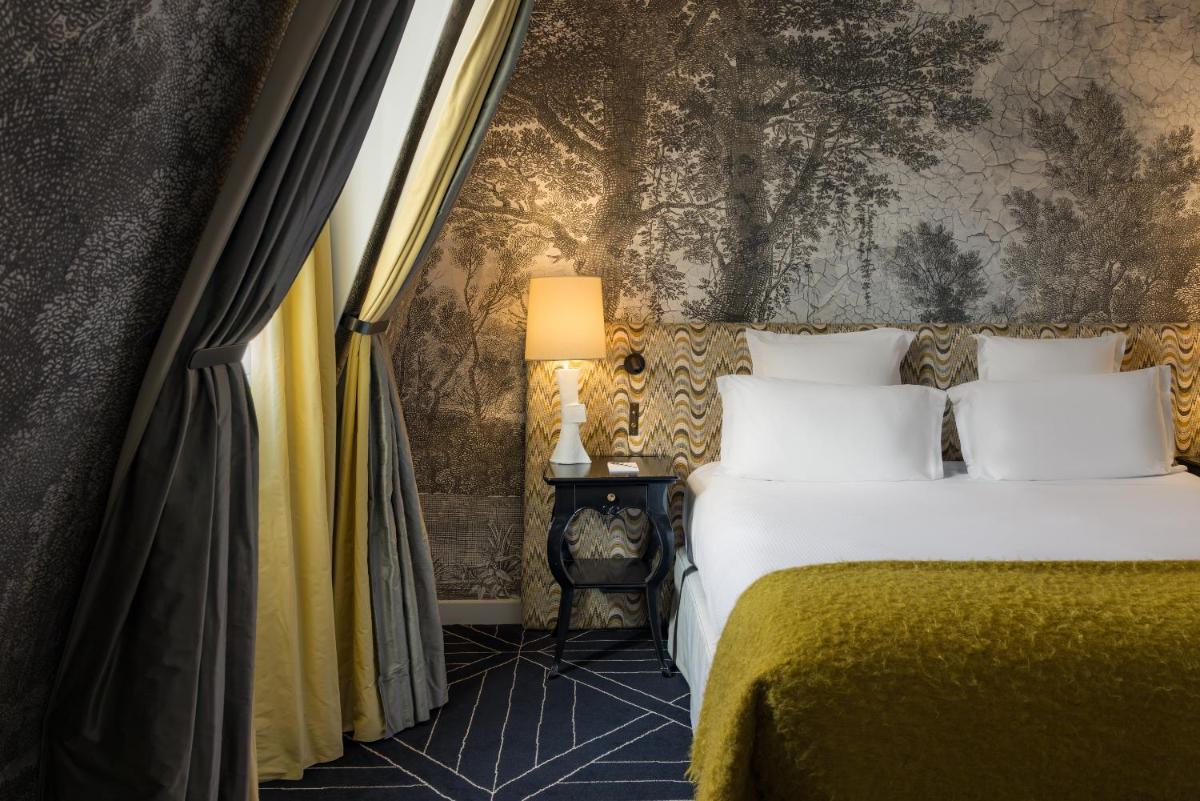 Un ou plusieurs lits dans un hébergement de l'établissement Le Pavillon de la Reine & Spa, Place des Vosges