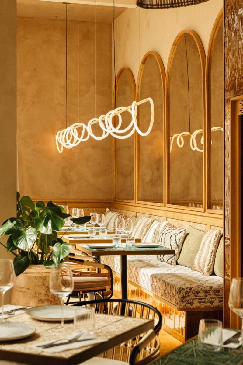 Coin salon dans l'établissement Bloom House Hôtel & SPA