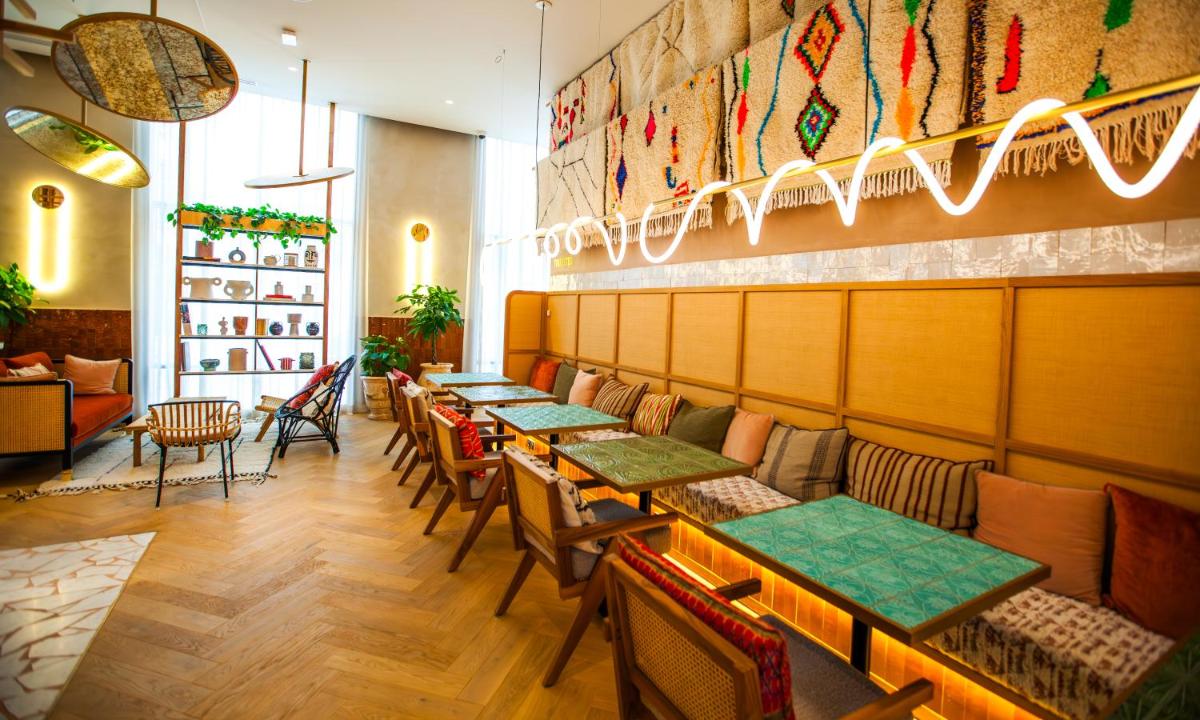 Coin salon dans l'établissement Bloom House Hôtel & SPA