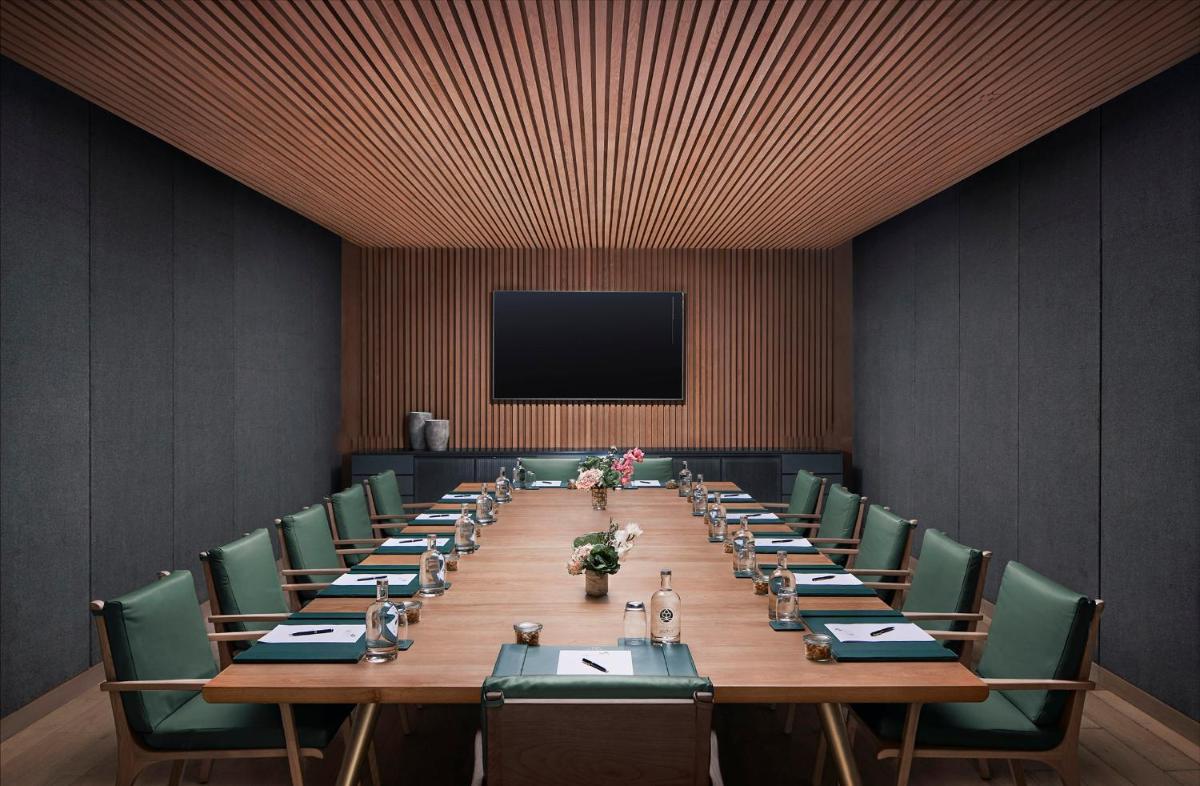 a large conference room with a long table and chairs at Taj The Trees, Mumbai in Mumbai