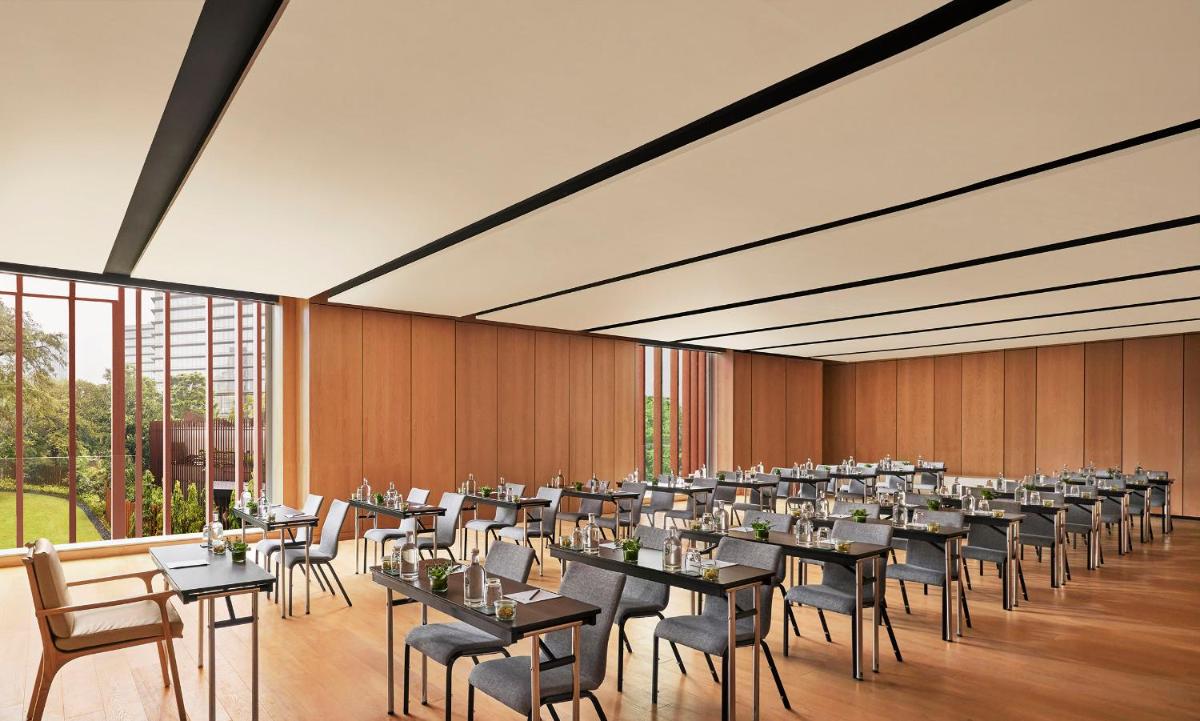 a large banquet hall with tables and chairs at Taj The Trees, Mumbai in Mumbai a large banquet hall with tables and chairs at Taj The Trees, Mumbai in Mumbai
