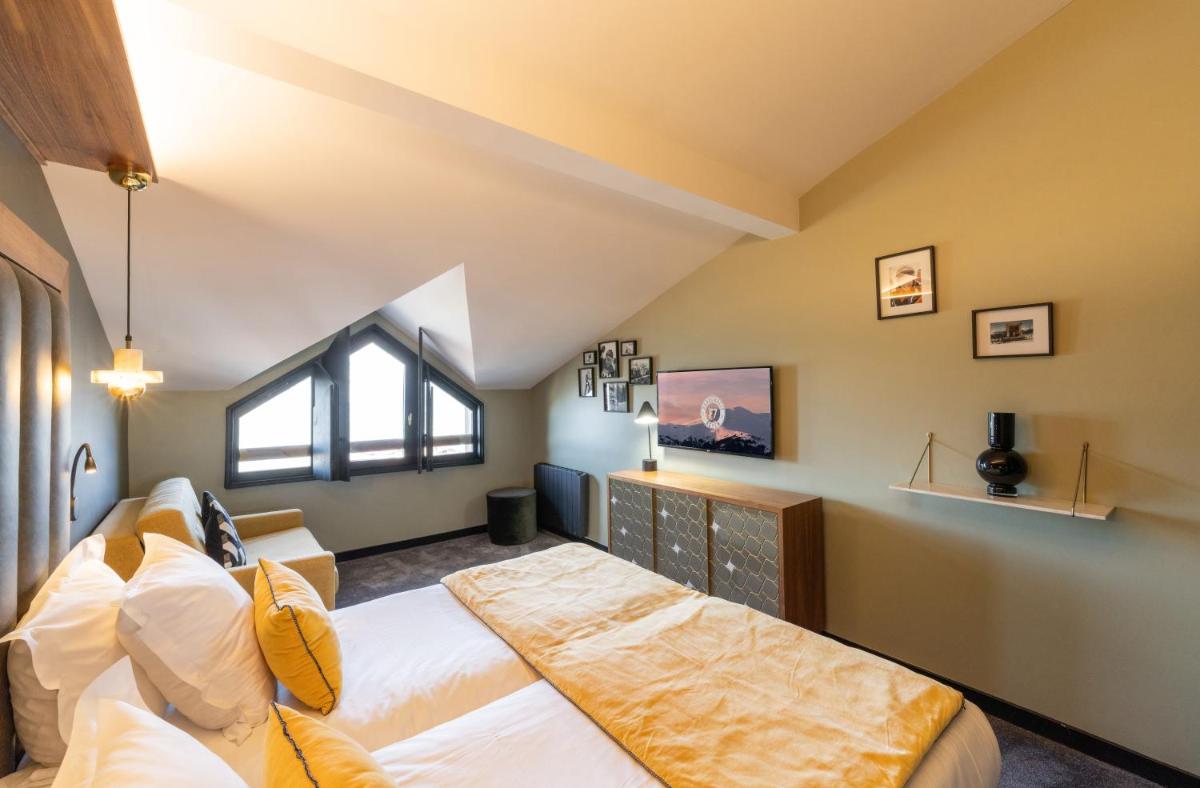 Un ou plusieurs lits dans un hébergement de l'établissement Fahrenheit Seven Courchevel