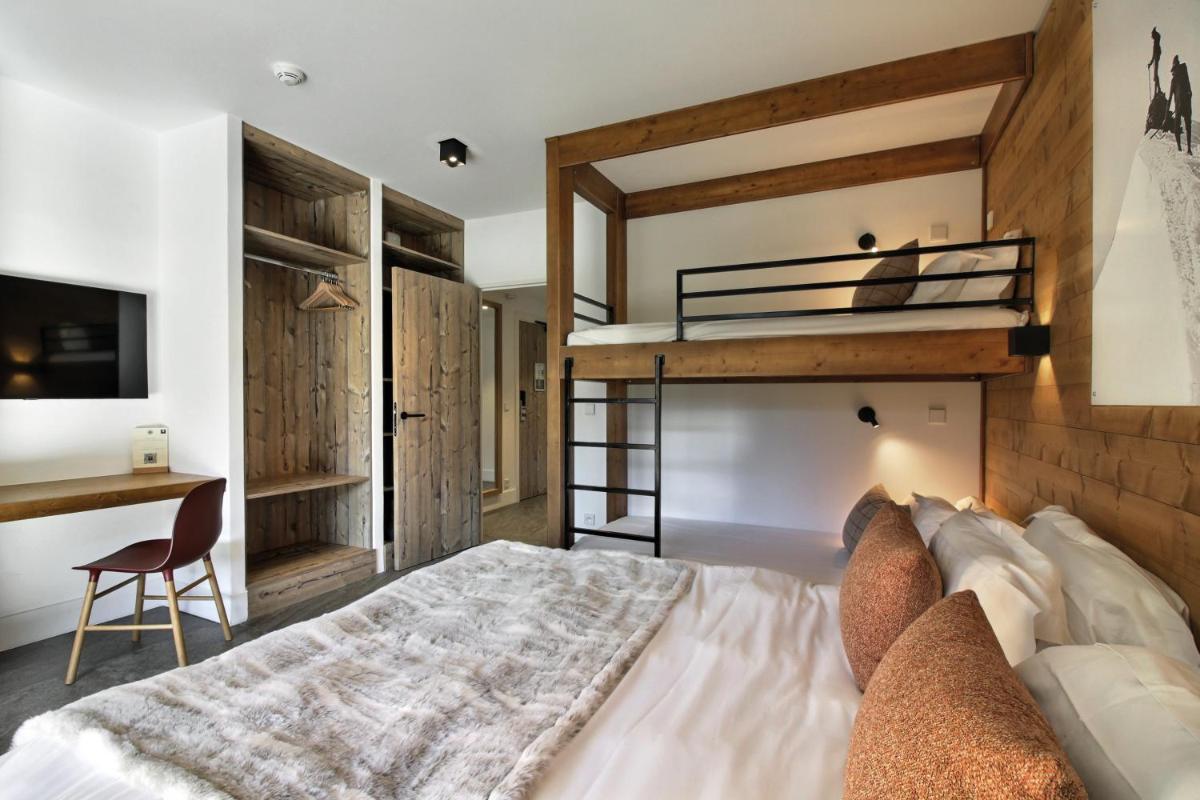 Un ou plusieurs lits dans un hébergement de l'établissement Pure Montagne Resort & Spa