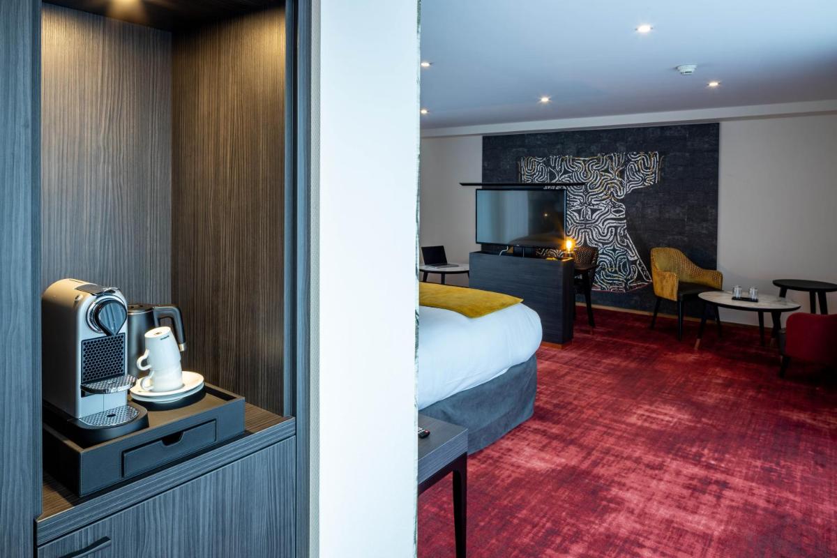 Coin salon dans l'établissement Hôtel Villa La Florangerie - SPA & Piscine
