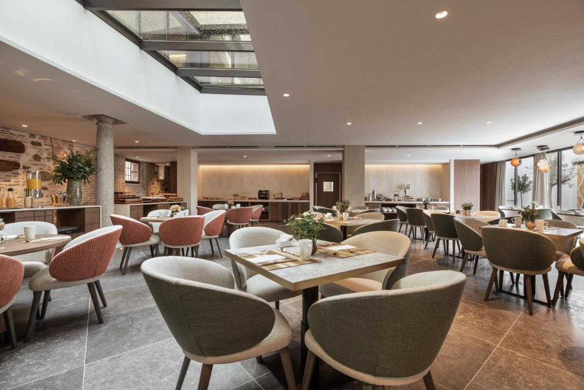 Un restaurante o sitio para comer en Áurea Toledo by Eurostars Hotel company