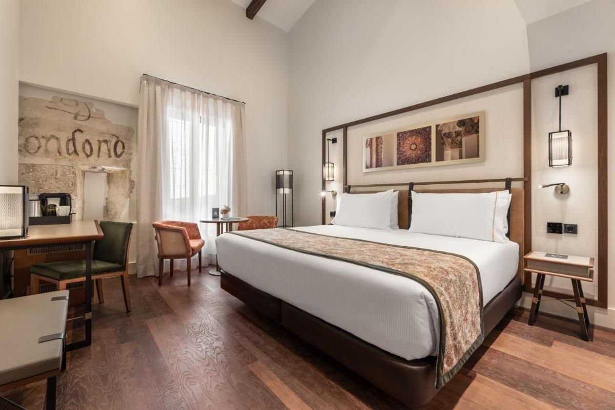 Cama o camas de una habitación en Áurea Toledo by Eurostars Hotel company
