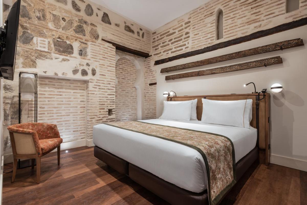 Cama o camas de una habitación en Áurea Toledo by Eurostars Hotel company