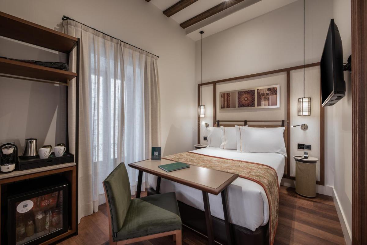 Cama o camas de una habitación en Áurea Toledo by Eurostars Hotel company