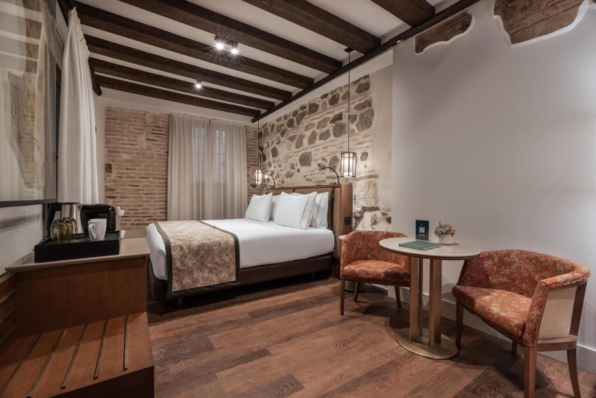 Cama o camas de una habitación en Áurea Toledo by Eurostars Hotel company