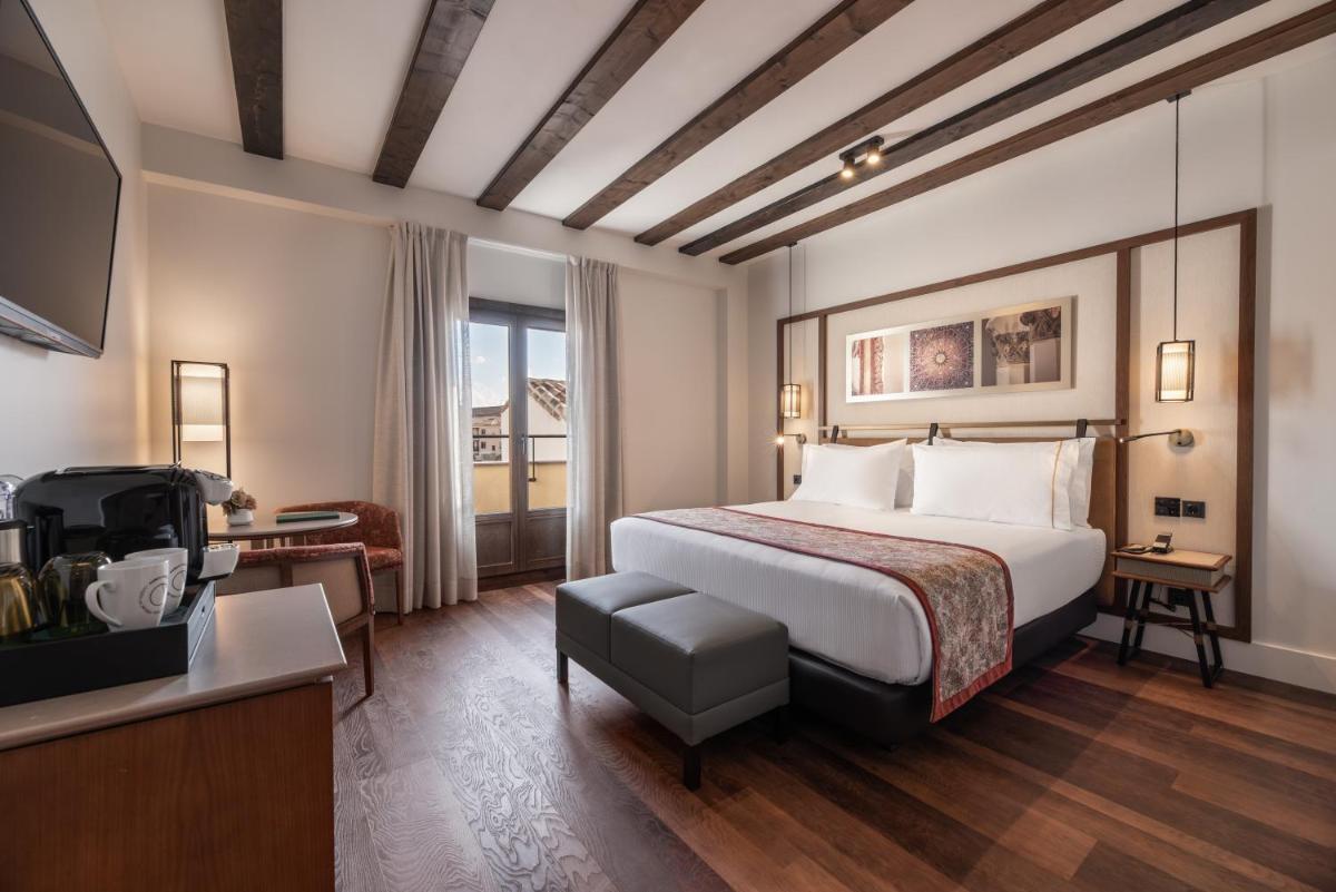 Cama o camas de una habitación en Áurea Toledo by Eurostars Hotel company