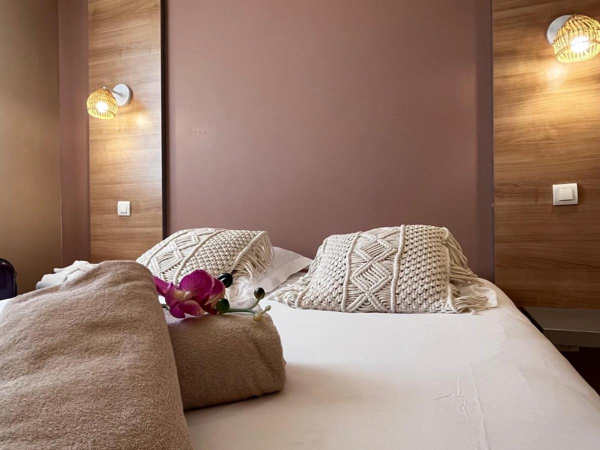 Un ou plusieurs lits dans un hébergement de l'établissement Résidence Hôtelière Natureva & Spa