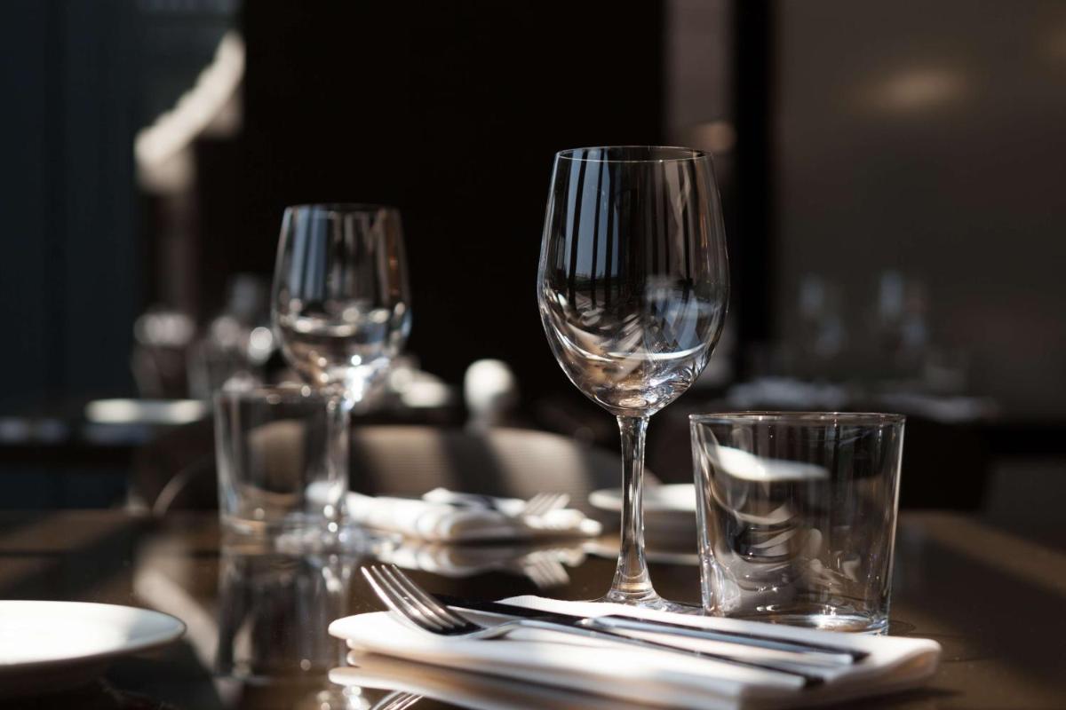 three empty wine glasses sitting on a table at Radisson Hotel Shimla in Shimla