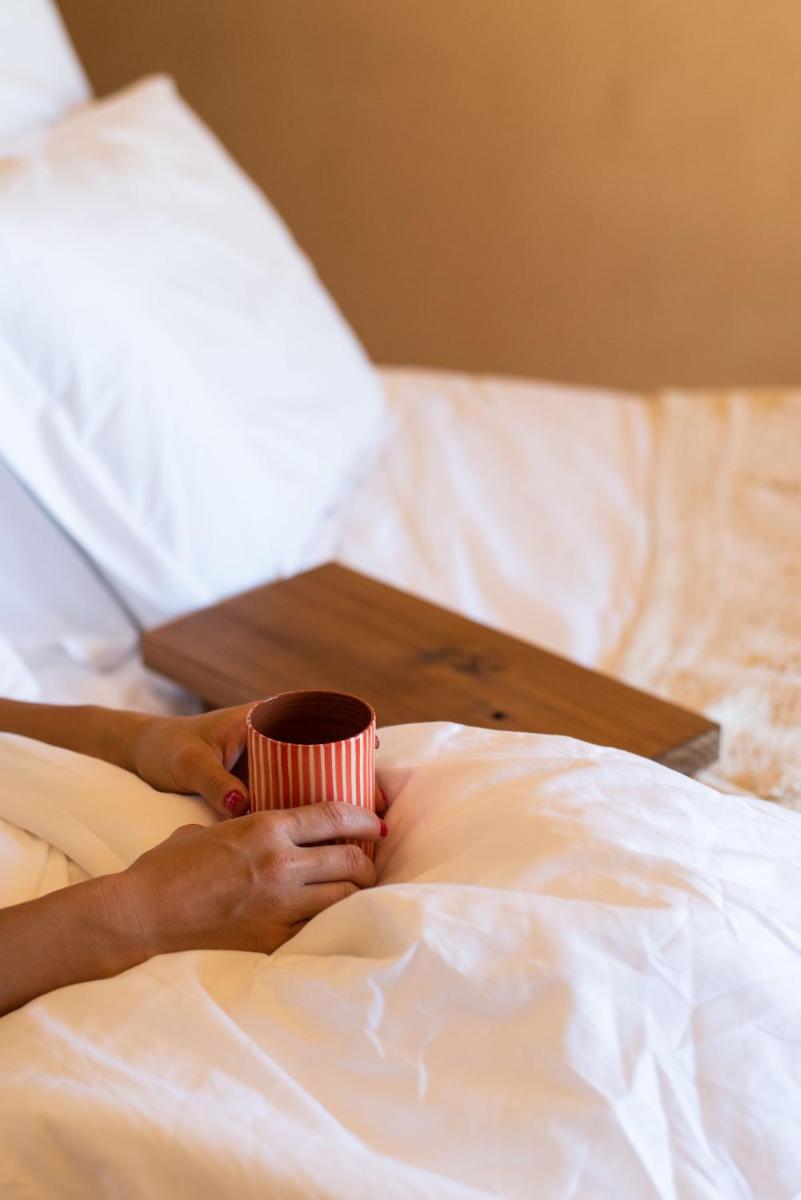 Uma cama ou camas num quarto em Independente Comporta