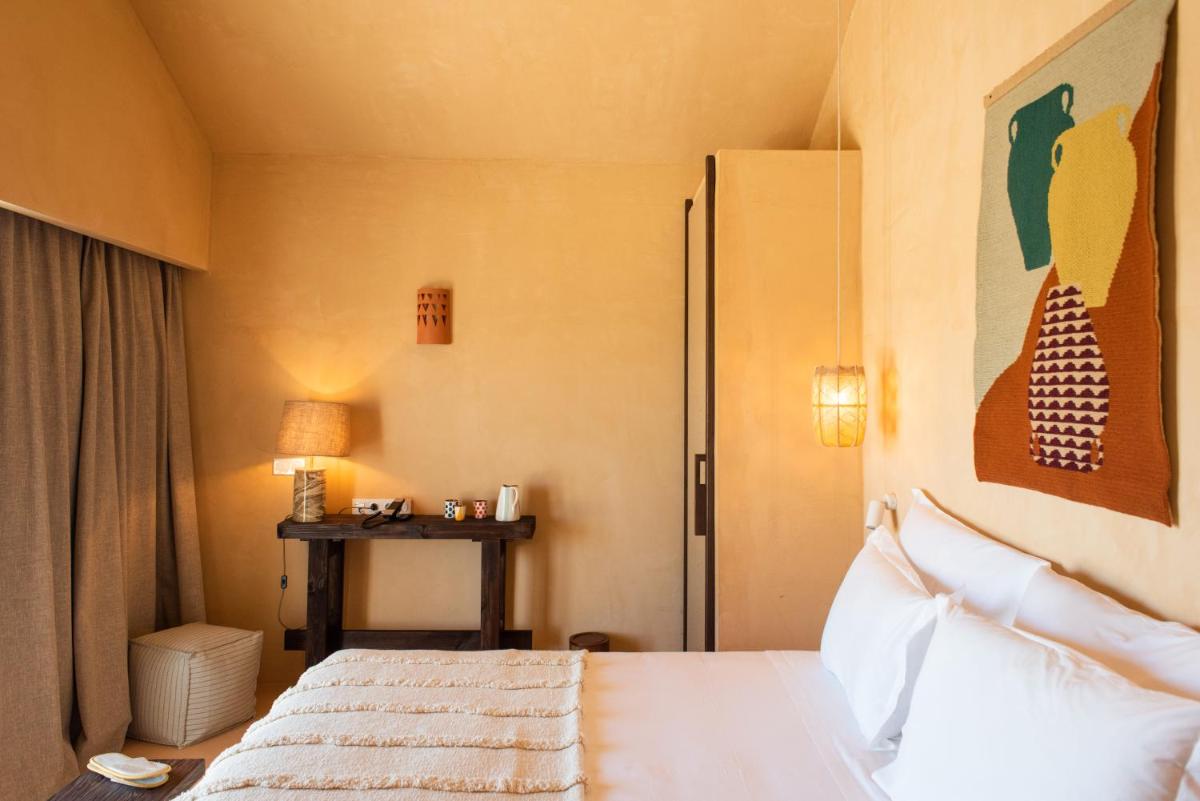 Uma cama ou camas num quarto em Independente Comporta