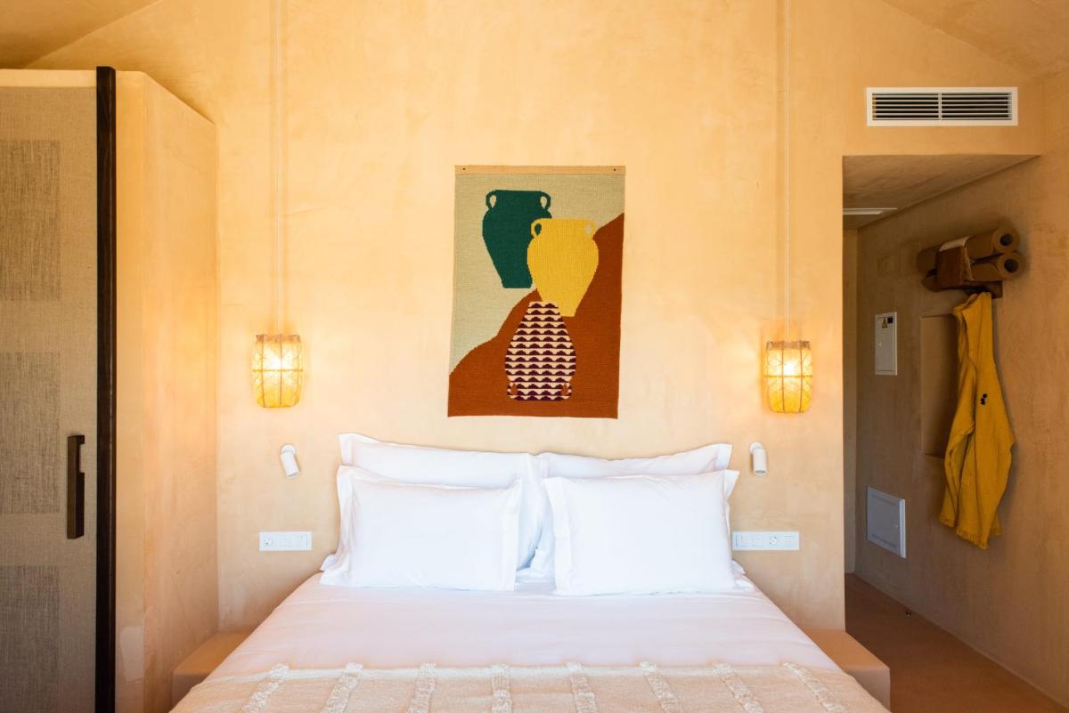 Uma cama ou camas num quarto em Independente Comporta