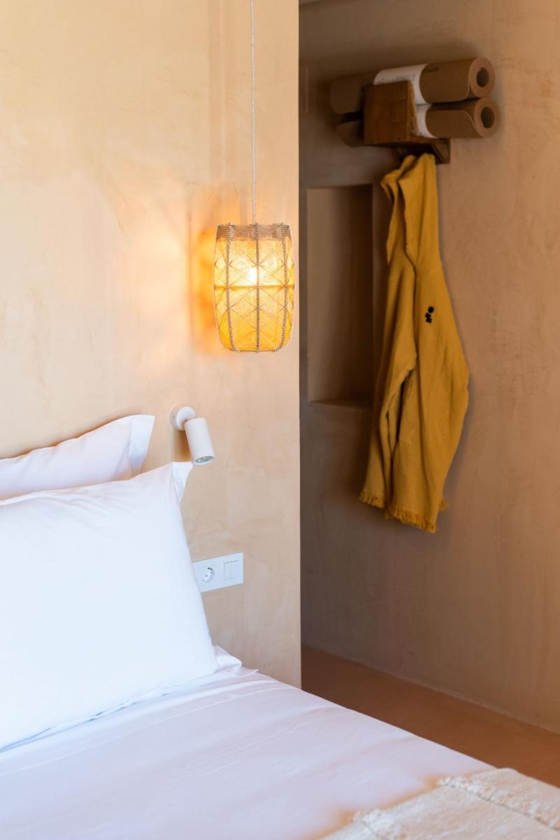 Uma cama ou camas num quarto em Independente Comporta