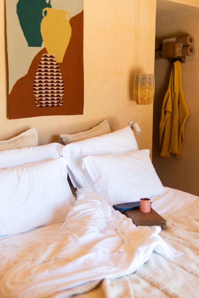 Uma cama ou camas num quarto em Independente Comporta