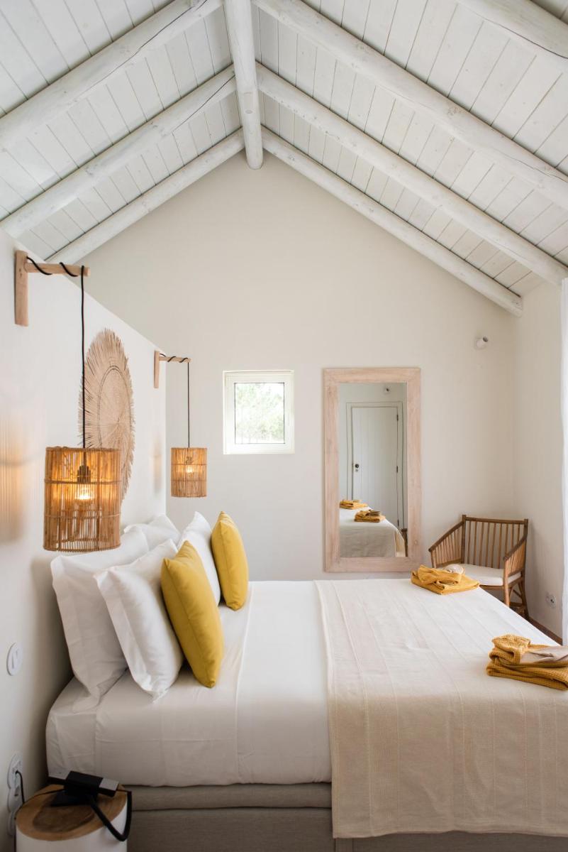 Uma cama ou camas num quarto em Independente Comporta