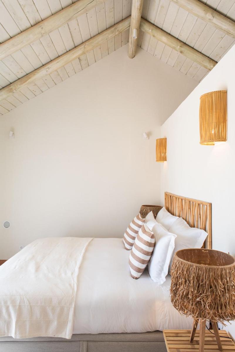 Uma cama ou camas num quarto em Independente Comporta