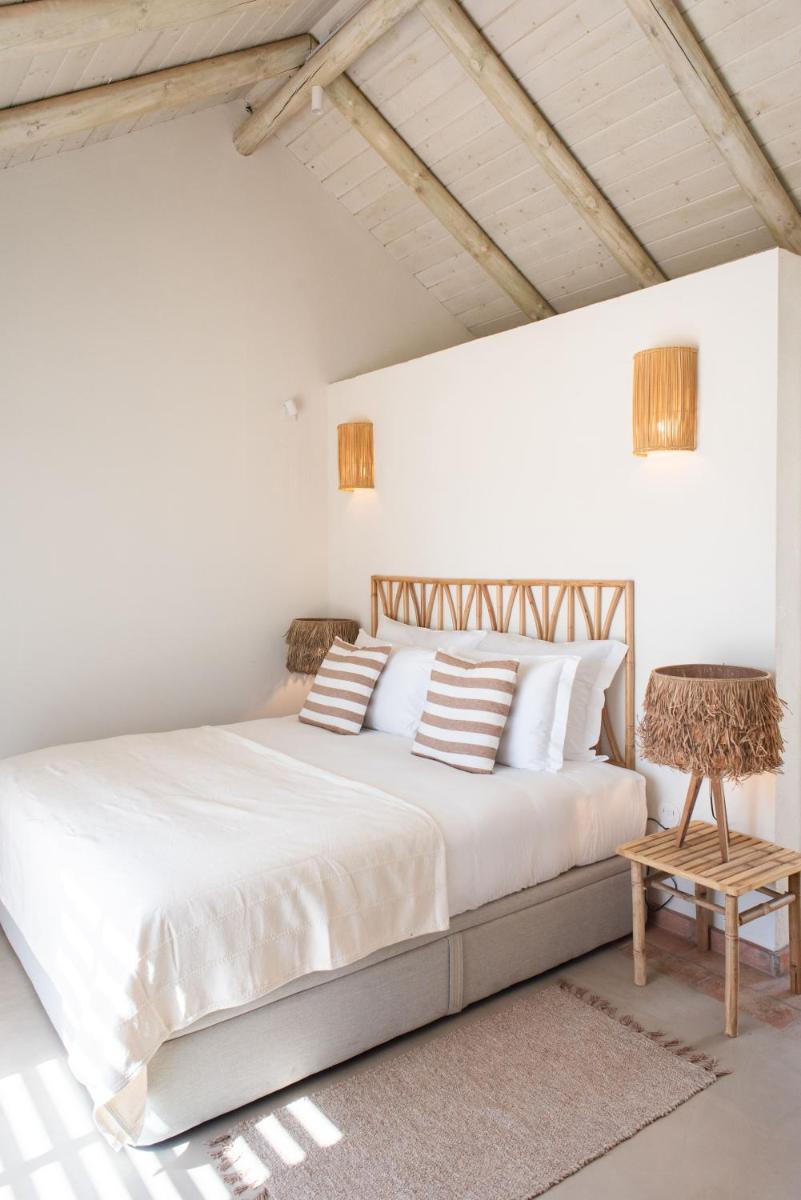 Uma cama ou camas num quarto em Independente Comporta