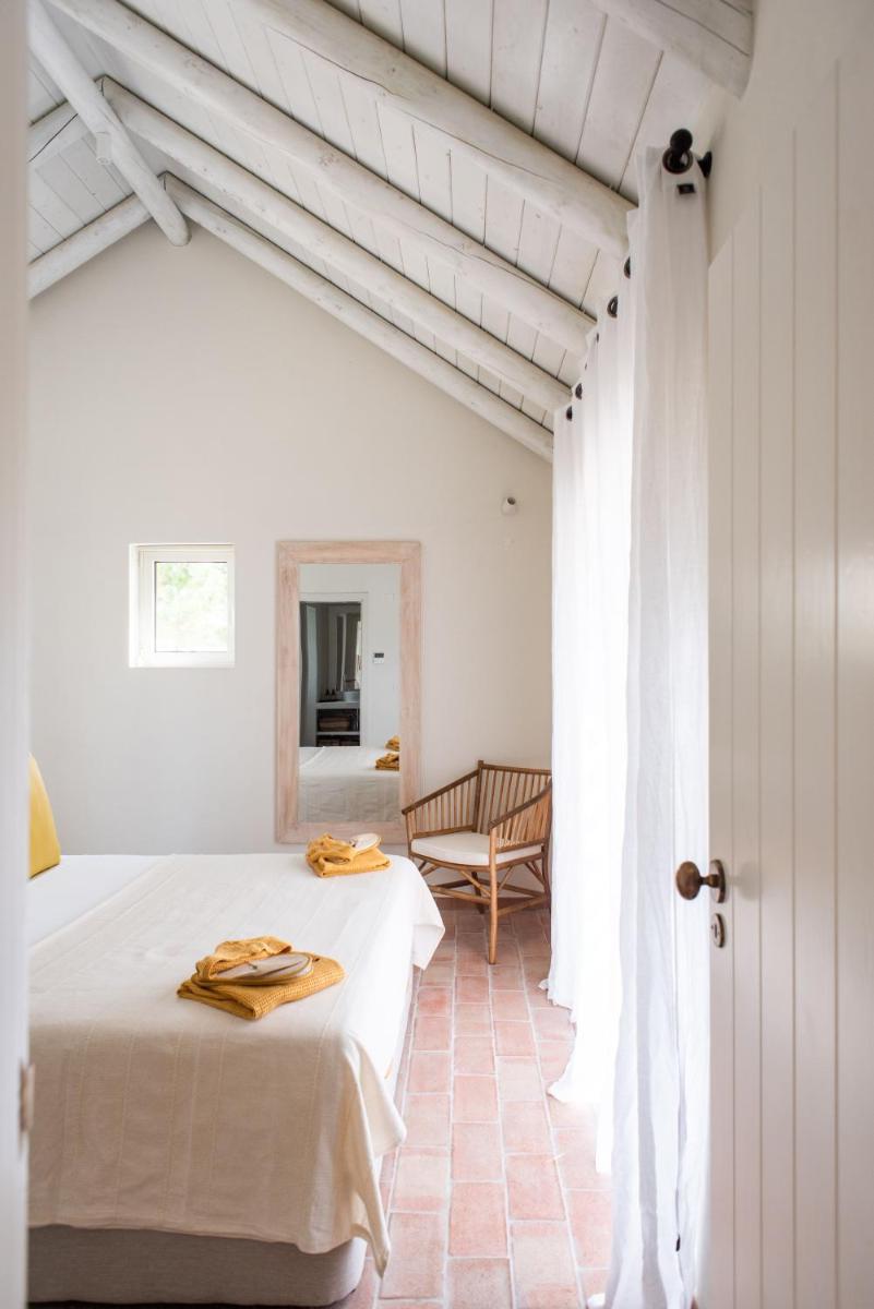 Uma cama ou camas num quarto em Independente Comporta