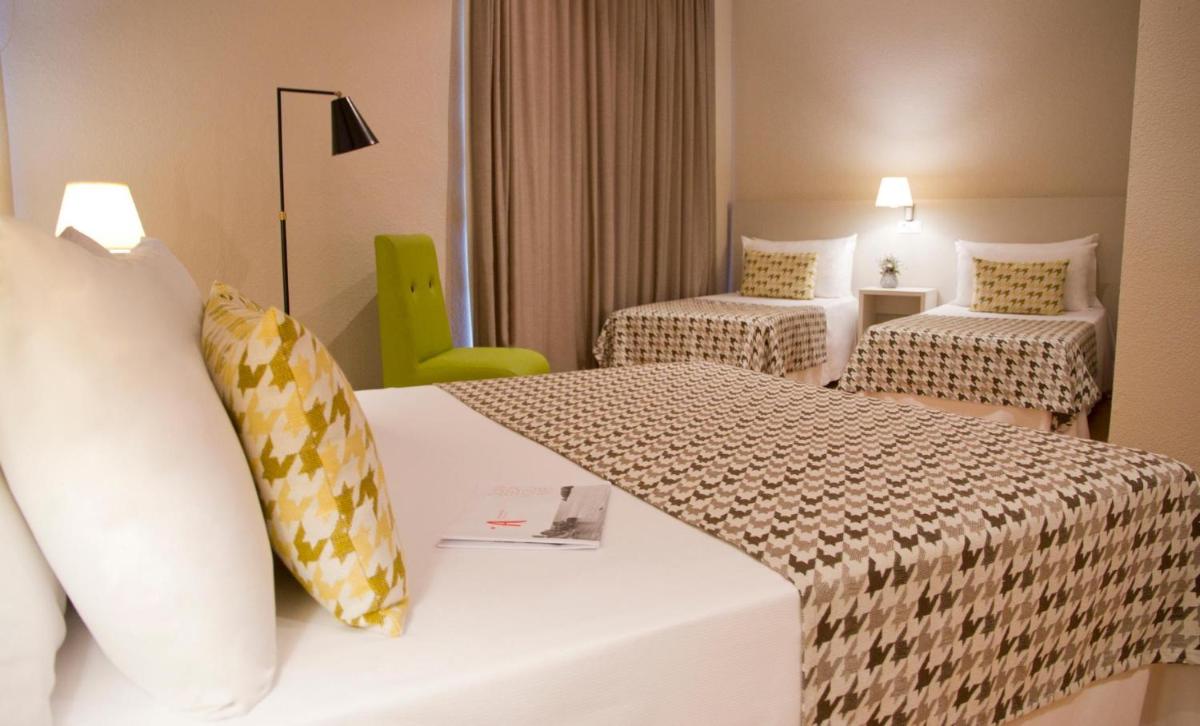 Cama o camas de una habitación en ALEGRIA Plaza Paris 4*Sup