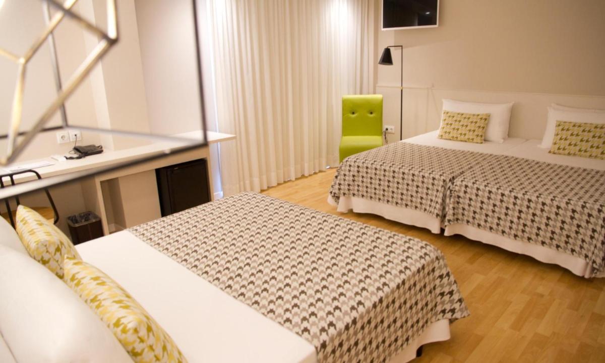 Cama o camas de una habitación en ALEGRIA Plaza Paris 4*Sup