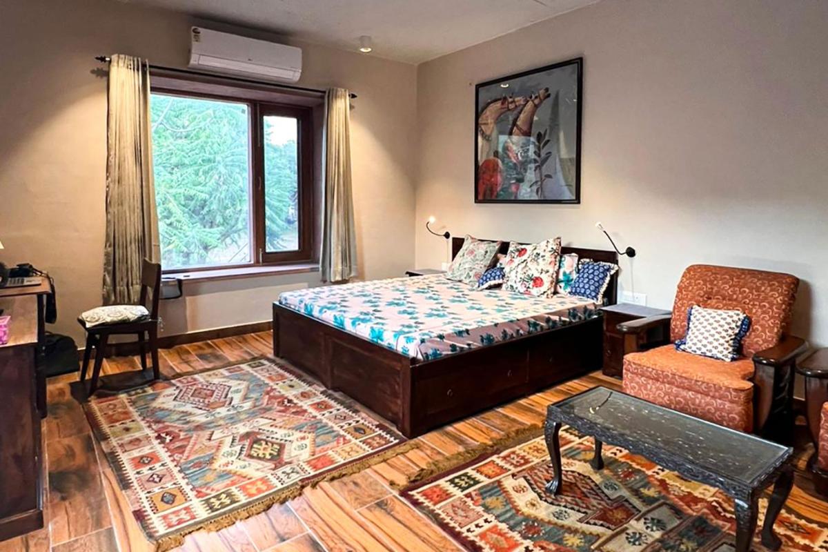 StayVista presents The Owl House, a Hillview villa featuring Inviting rooms, A cozy terrace & A beautiful lawn - Housity